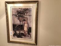 Front view showing print of two children, gold-tone ornate frame