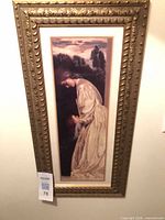 Full view of framed female portrait print on wall