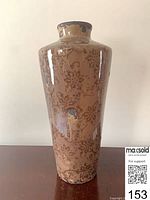 Full front view of ceramic vase showing shape and floral pattern