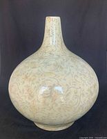 Front view of bulbous ceramic vase showing color and swirl pattern