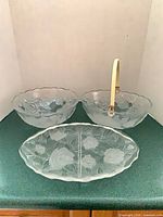 All three pressed glass pieces together: salad bowl, handled basket bowl, divided platter