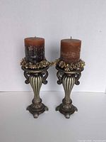 Front view of both candle holders with candles and wreaths in place