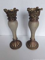 Front view of both matching Casa Elite candle holders showing overall design and condition