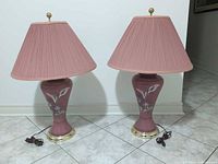 Two matching pink floral ceramic table lamps with shades and cords