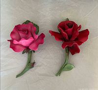 Both porcelain rose boutonnieres side by side