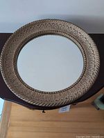 Front view of round mirror showing entire frame and glass