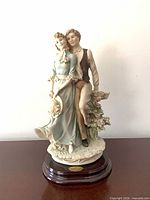 Front view of Giuseppe Armani "Together" figurine on wooden base