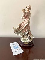 Front view of Giuseppe Armani Play Mates figurine on wooden base