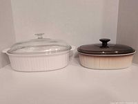 Both casseroles side by side, lids on