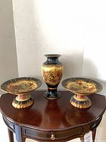 Vase and two pedestal compotes on table, full view