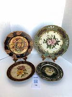 Group shot of four decorative floral wall plates