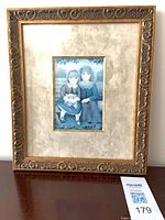 Full view of framed print with mat and ornate frame