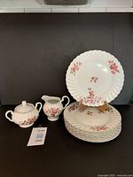 Full set: stacked dinner plates, covered sugar bowl, creamer