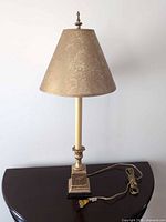 Full view of lamp showing base, column, shade and cord