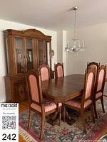 table and six chairs in dining room setting