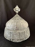 Front view of clear cut crystal lidded bowl showing pattern and finial