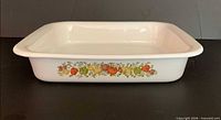 Side view showing Spice of Life vegetable motif and overall dish shape