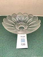 Angled front view of clear and frosted crystal bowl showing petal pattern and depth