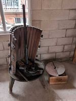 Overall lot showing basket segments, spindle, cast iron base and crate with discs