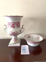 Urn and bowl side by side on tabletop showing overall design and size