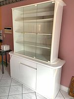Full view of hutch showing glass doors and lower storage base