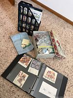 Overview of lot showing binder, beads box, magazine holder, and towel