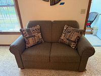 Front view of loveseat with two pillows