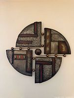 Front view of circular abstract metal wall art