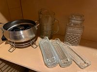 Entire lot showing fondue pot, pitcher, canister, four relish trays