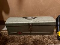 closed olive green steel toolbox front view