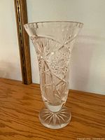 Tall cut crystal vase with starburst pattern