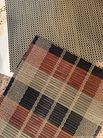 Bamboo slat placemat and woven poly check placemat
