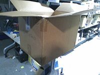 Open corrugated master carton labelled Jun 2010 showing capacity for multiple inner boxes of 3M masks