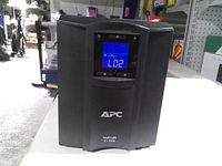 Front view showing APC Smart-UPS C1500 tower and LCD screen