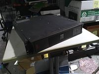 Front and side view of APC Smart-UPS SC1500 on table