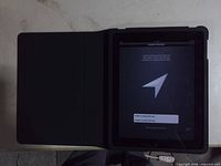 iPad inside folio cover, screen active on setup page