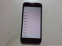 Front view of black Apple iPhone 7 powered on to setup screen