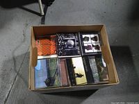 Top view of box showing multiple CDs with assorted album covers