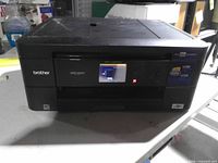 Front view of Brother MFC-J680DW printer showing touchscreen and branding