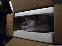 Slow cooker secured in styrofoam inside original box