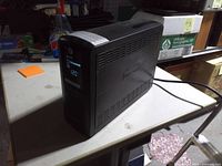 Full view of CyberPower UPS showing LCD screen and overall condition