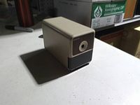 Beige Boston electric pencil sharpener on tabletop, front view