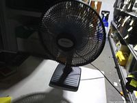 Front view of Holmes desk fan on table
