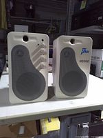 Front view of both Fine MS966 speakers showing grills, logo and control knobs