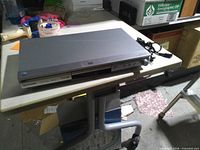 Front and top view of Panasonic silver DVD player