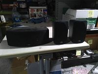 All three Polk Audio speakers on table