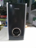 Front view showing Samsung logo, bass reflex port, trim