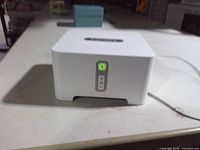 Front angled view showing LED and control buttons