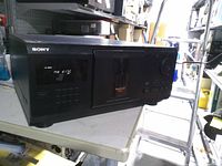Front view showing brand, controls, LCD display and disc door