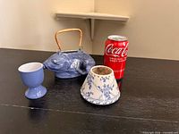 All three ceramic items with size reference can